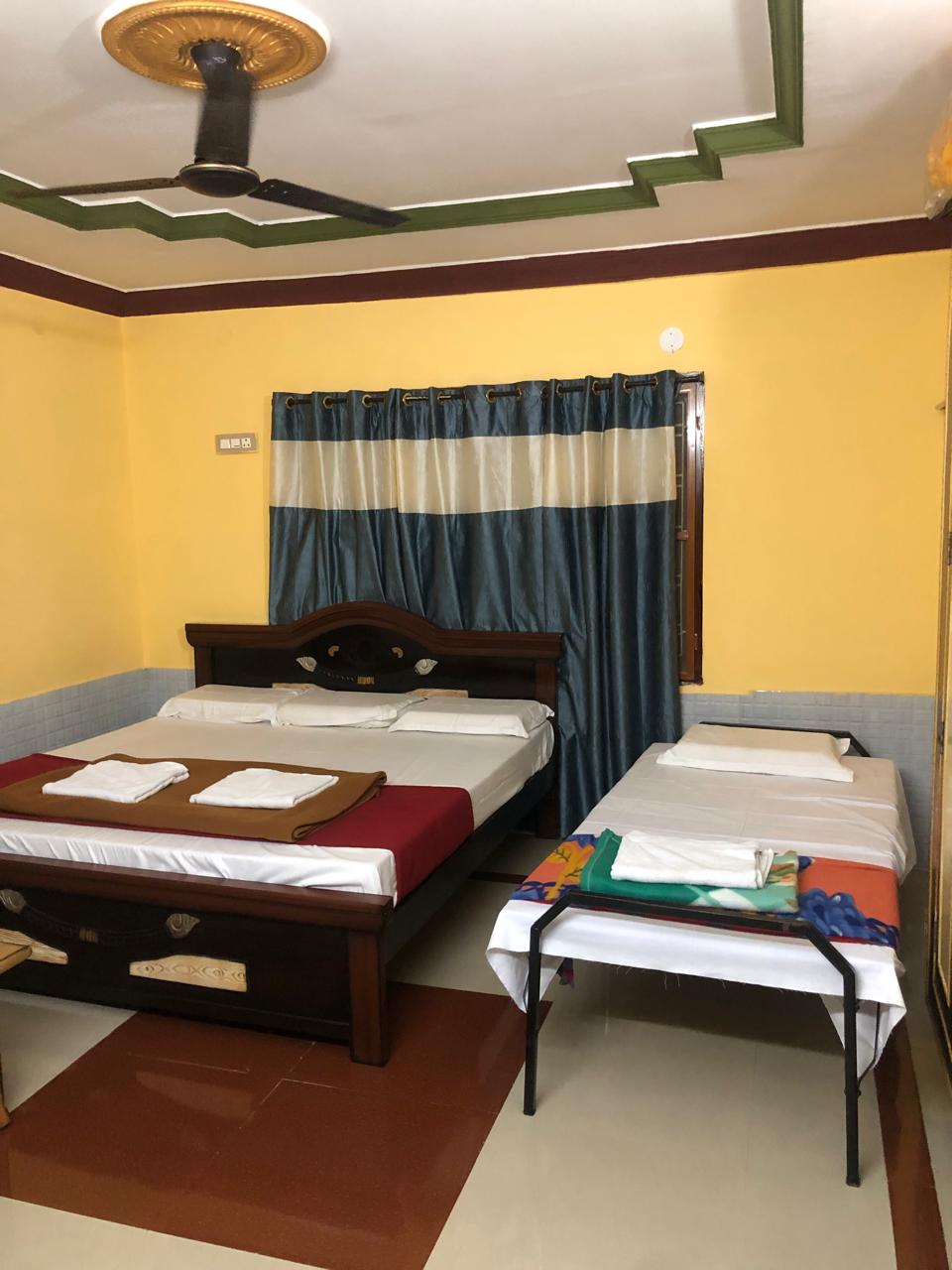 Bedroom with decorative ceiling and beds