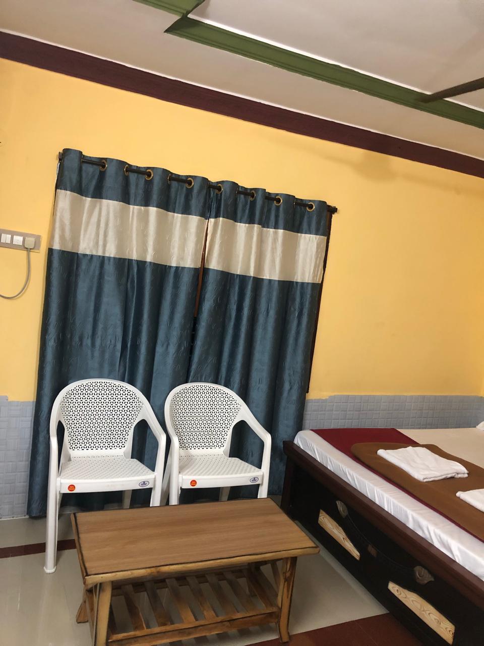Bedroom seating area with chairs and table