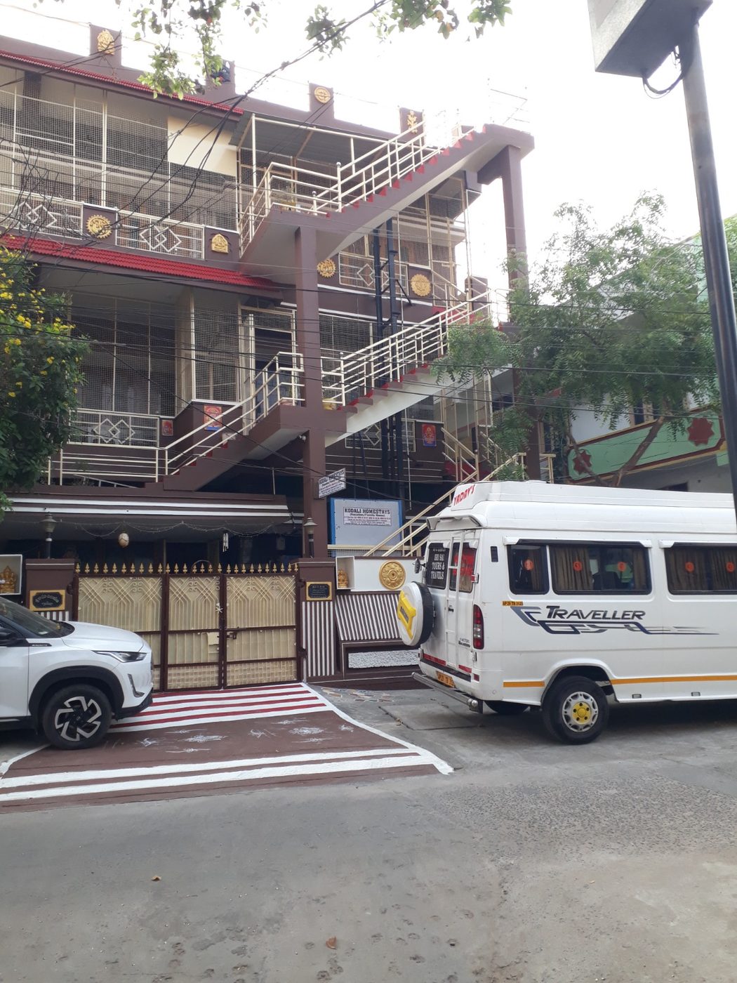 Kodali Homestays building entrance with signboard