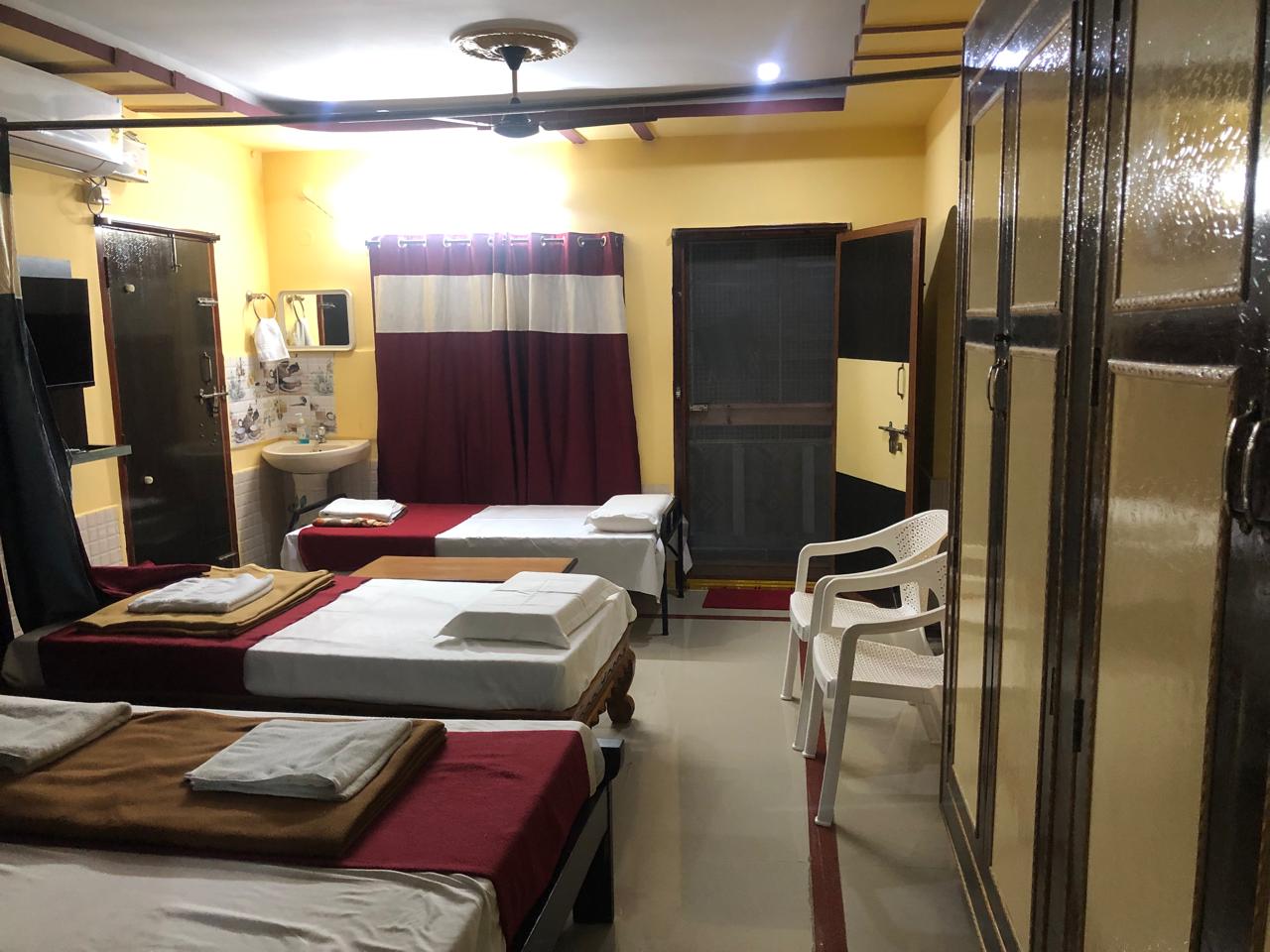 Three-bedroom home with three beds and a large wardrobe